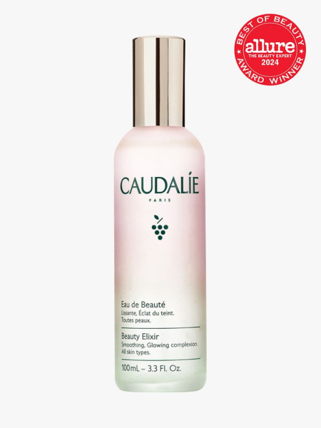 facial mist in branded gradient bottle with soft gold cap on light gray background with red and white 2024 allure best of beauty seal